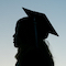 silhouette of student wearing a cap and gown